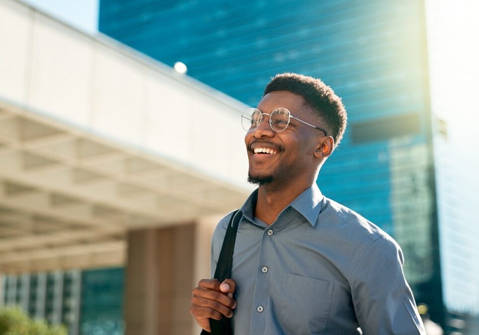 Business, happy and walking black man on city journey, commute trip and realtor smile on way to office building. Happiness, career expert and African real estate agent on morning travel in Nigeria.